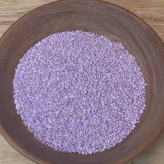 Video of dry Crushed Phosphosiderite being sprayed with water to show it wet.