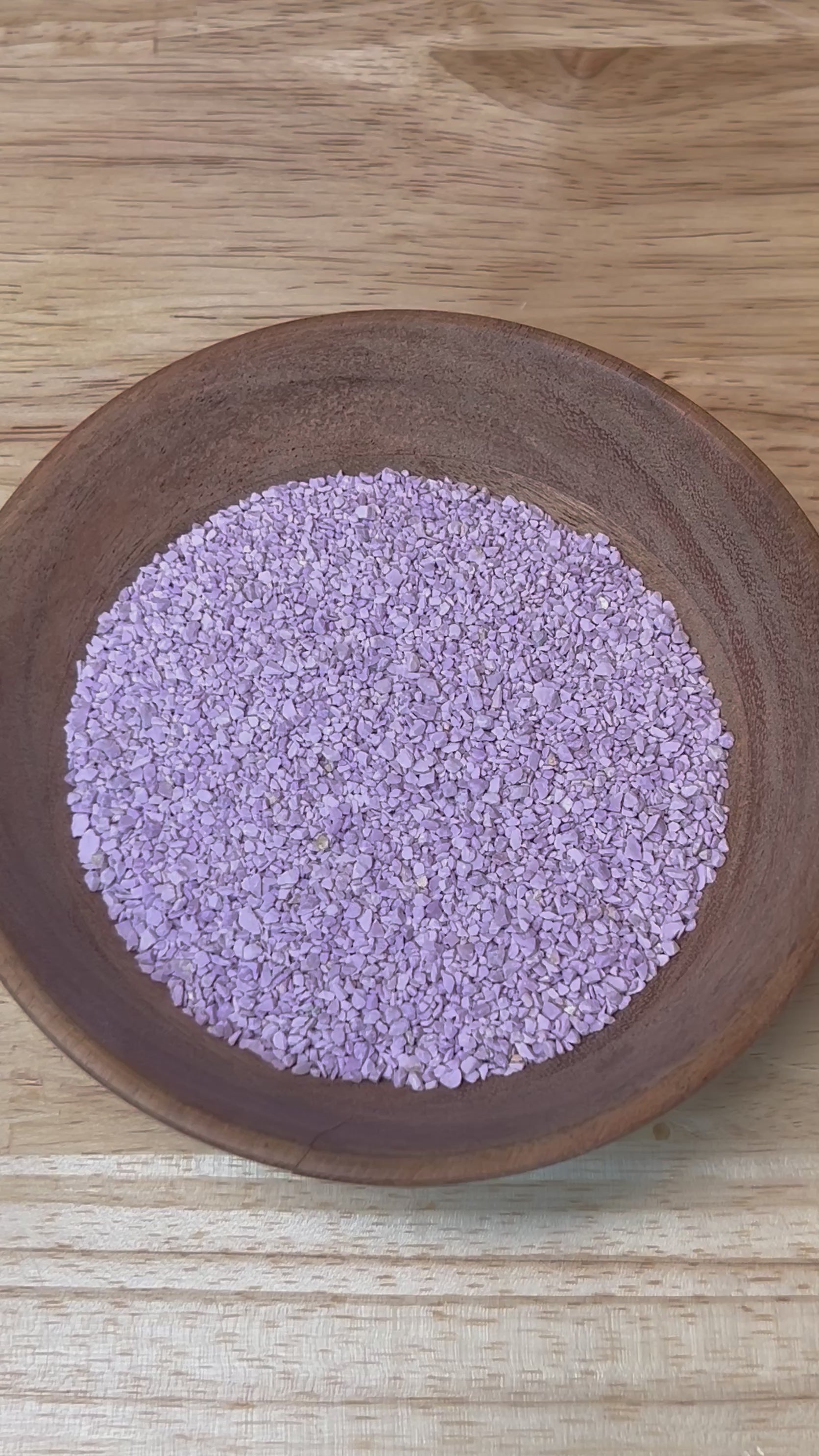 Video of dry Crushed Phosphosiderite being sprayed with water to show it wet.